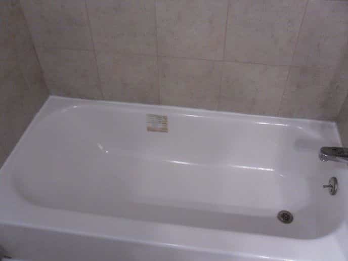 Finished Bootzcast tub installation with tile tub surround