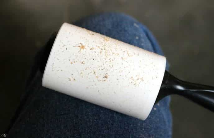 Lint rolling saw dust from clothing