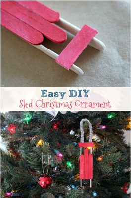 Easy DIY Wood Sled Christmas Ornament. Check out this easy tutorial to build popsicle stick wood sled Christmas ornaments! Build your own sled ornament easily!