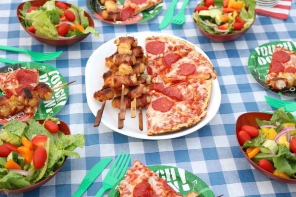 Grilled meal with pizza, salad and more