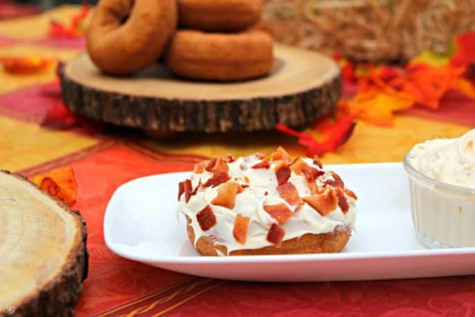 Bacon topped pumpkin donuts with cream cheese frosting
