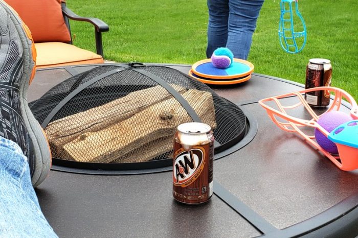 Root Beer BBQ Sauce, Fire pit table with can of A&W and backyard games