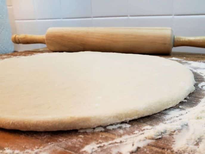 Philly Cheese Steak Pizza, Rolling out homemade dough for pizza