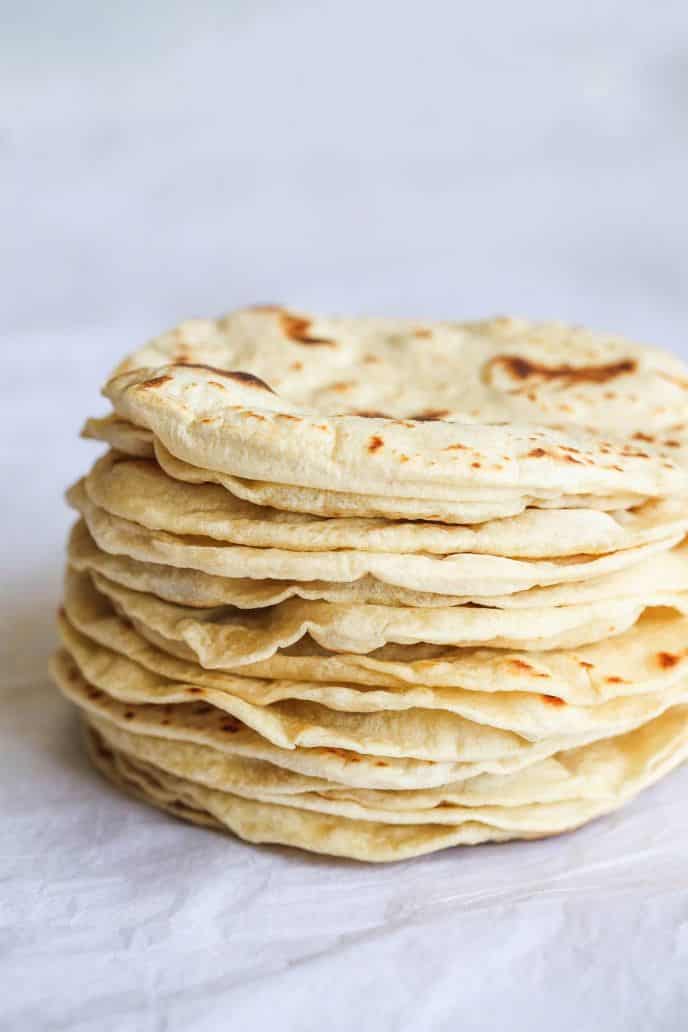 51+ No Yeast Bread Recipes, no yeast homemade flatbread, stacked high on a table