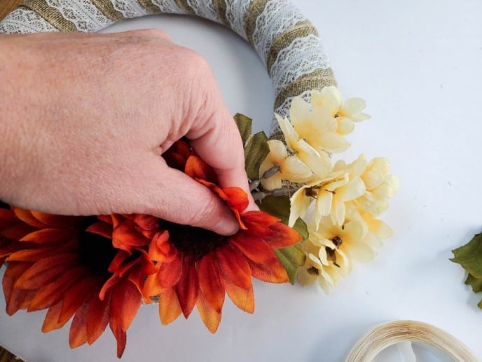 Thanksgiving Wreath, Stick the flowers to the burlap wrapped wreath form