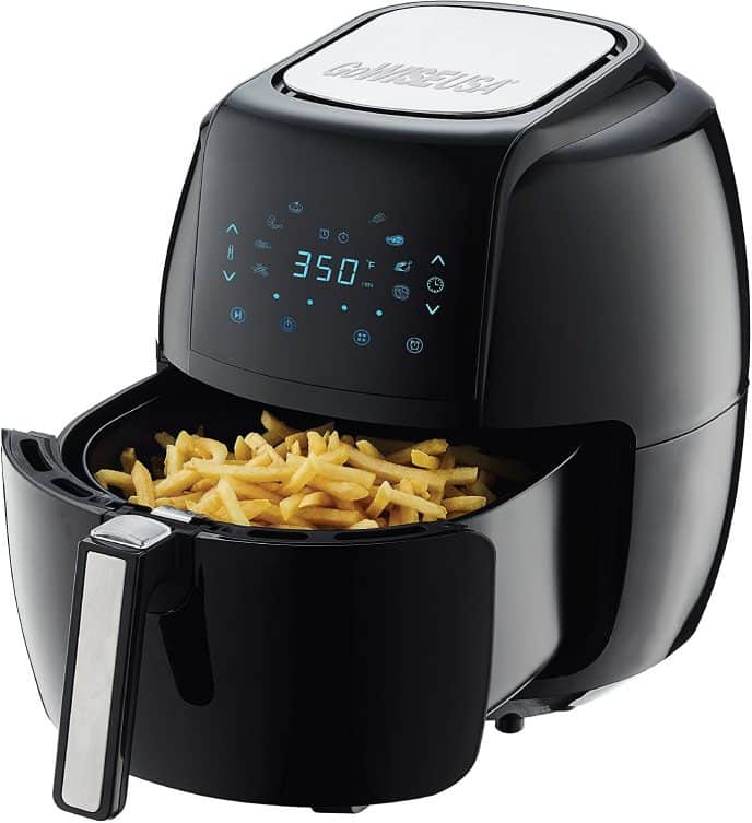 Learn how to use an air fryer, an air fryer half open with cooked French fries inside