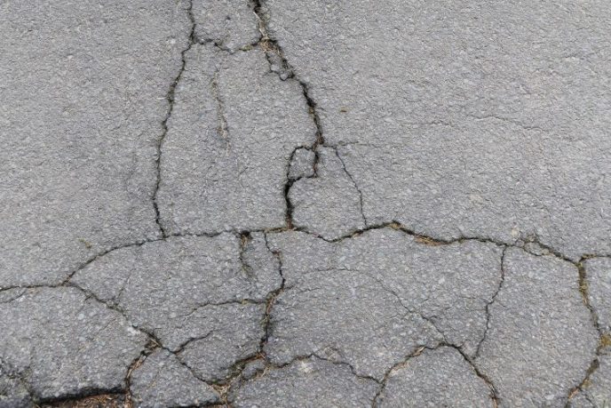 Fix A Cracked Driveway Multiple cracks in paved asphalt driveway