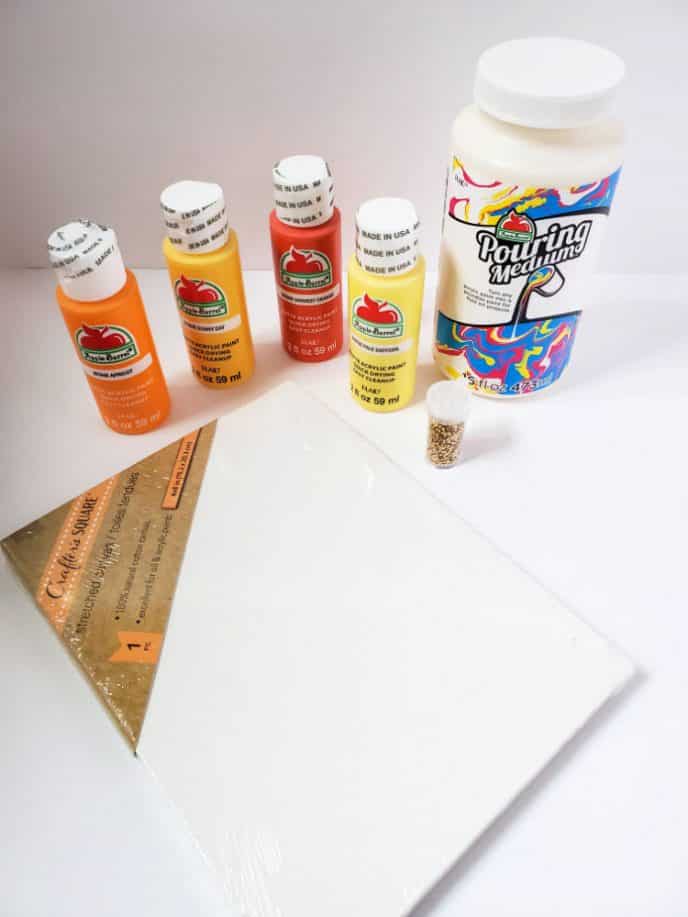 Acrylic Paint Pour Materials for acrylic paint pour such as paint, canvas, pouring medium and tools needed.