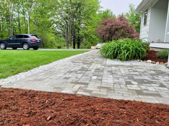 DIY Paver Walkway Installation with Marble and Mulch Borders